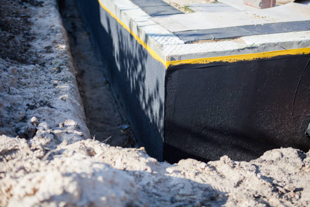 Professional Basement Waterproofing technician working in Montgomery, GA